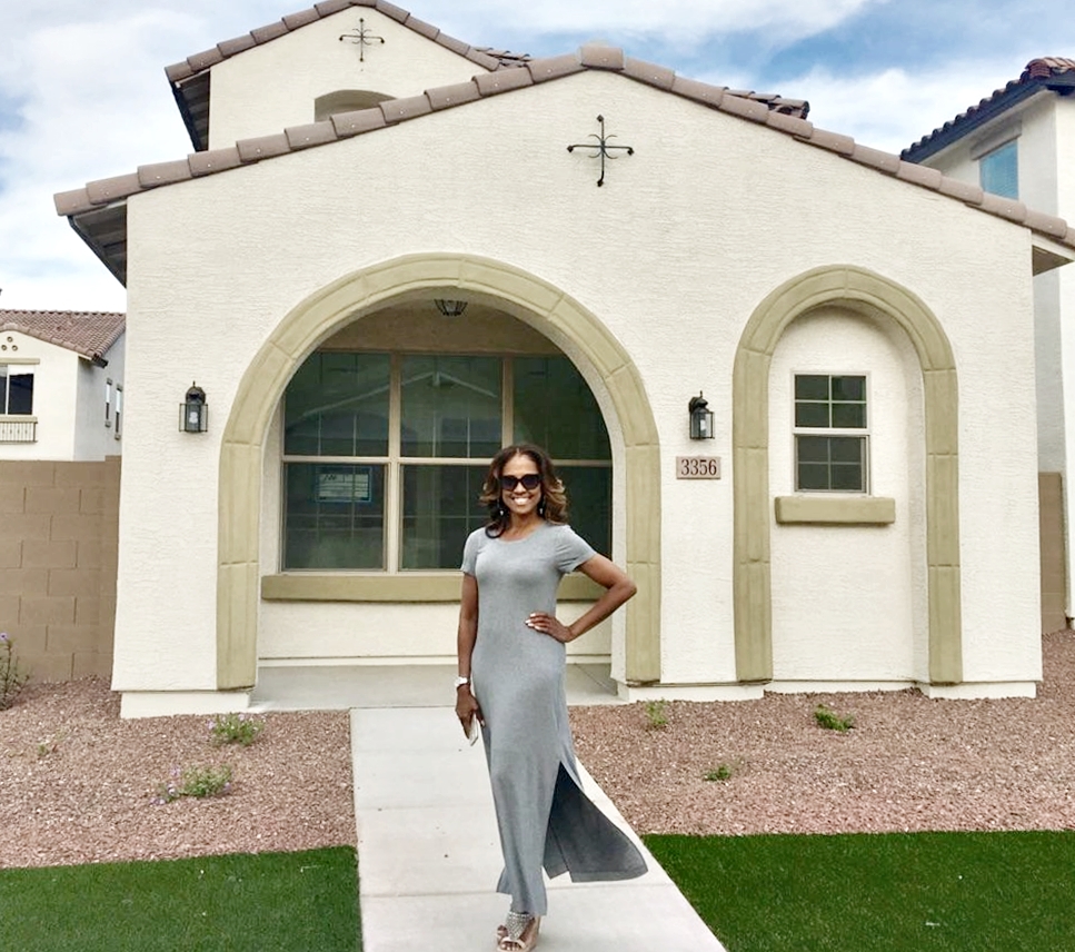 Ingrid Bohannon in front of The Dollhouse