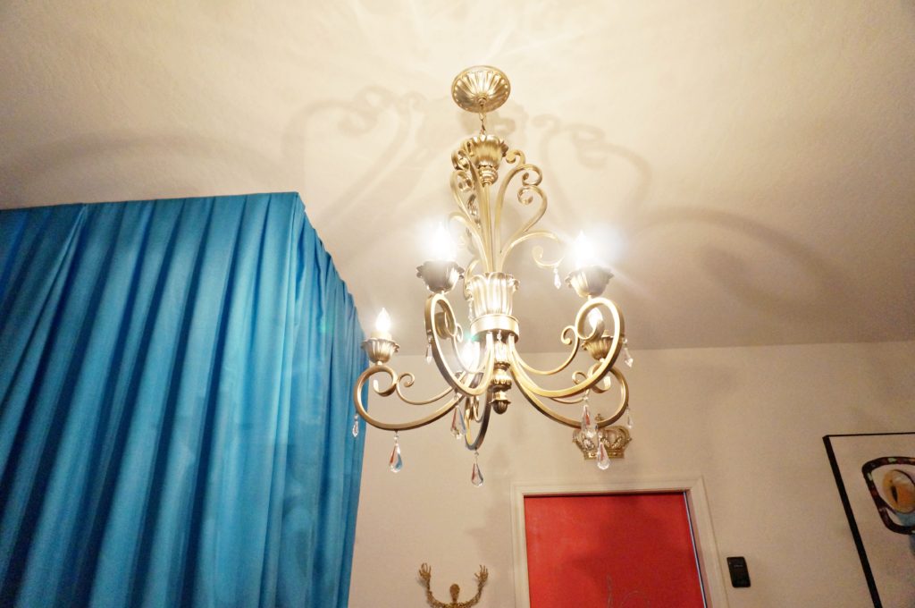 The Queen's Quarters Garage Decor using re-purposed chandelier