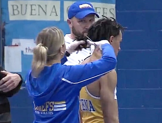 Black wrestler's dreadlocks being cut before he can compete