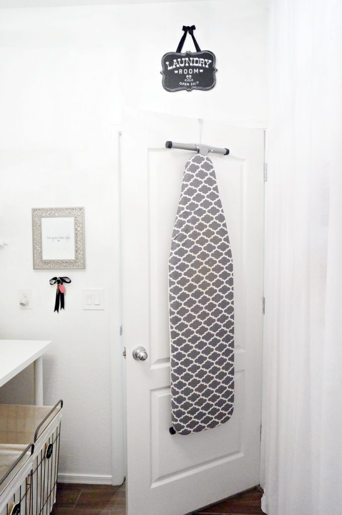 ironing board stored on back of door