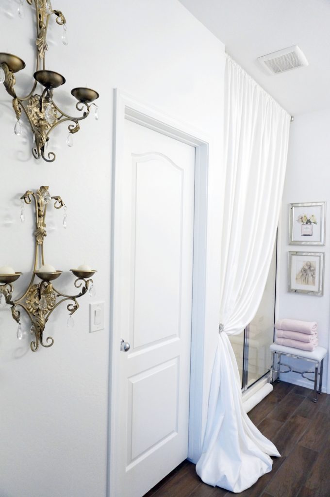 updated master bathroom with mixed metals