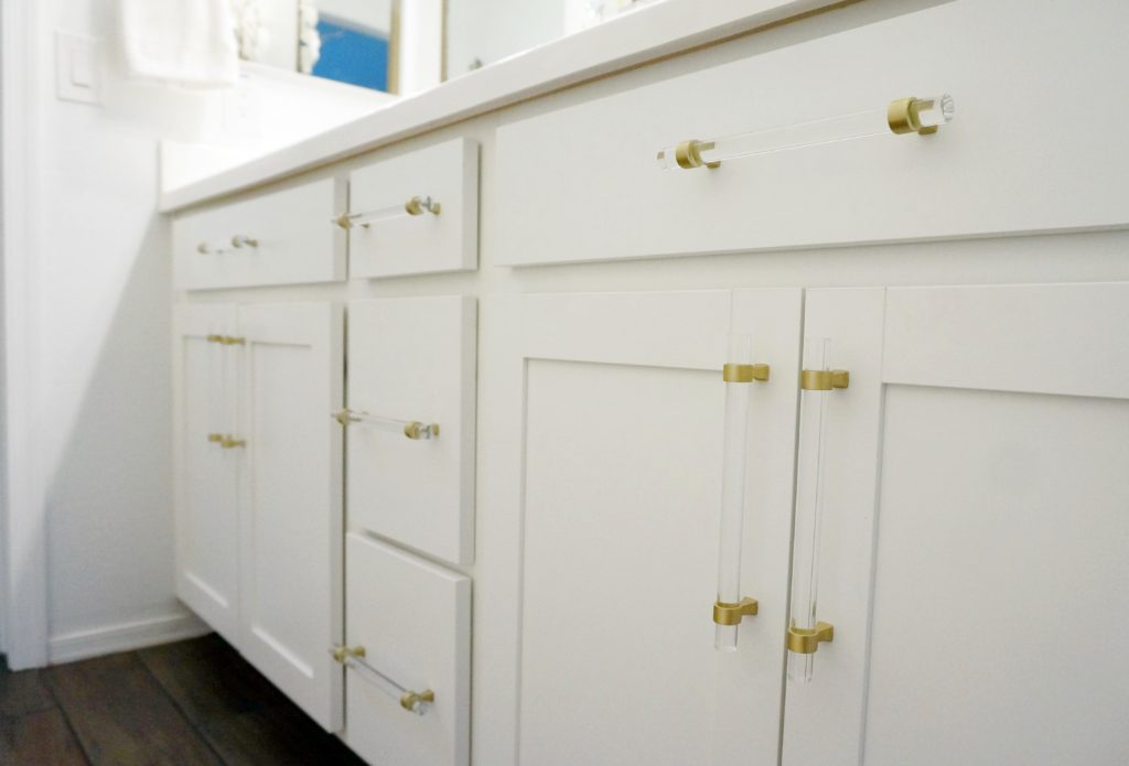 GlideRite lucite and gold drawer pulls in master bathroom